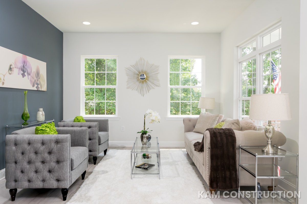 Staged living room with tufted furniture