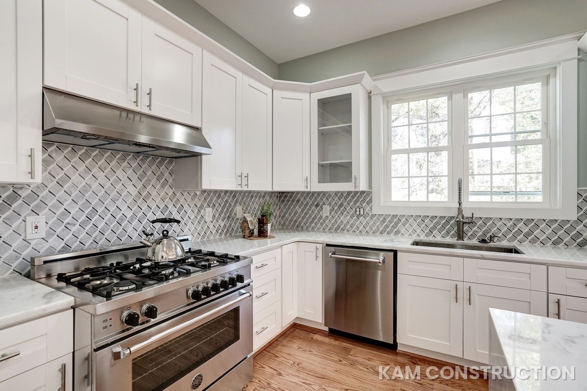 Kitchen renovation with professional range and diamond-pattern tile backsplash